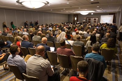 Image of a crowded Conference Panel Session